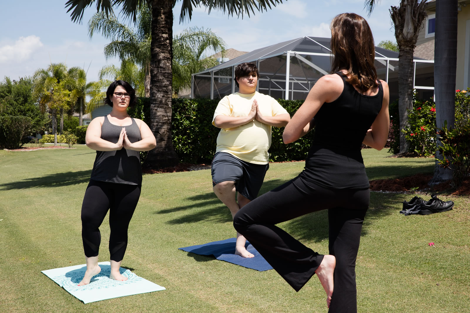 A couple attend a yoga class