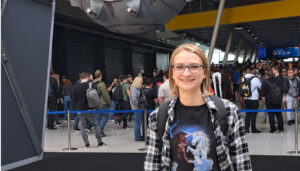 Julia Mueller standing in front of a large star wars statue.